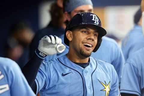 Apr 26, 2022; St. Petersburg, Florida, USA;  Tampa Bay Rays catcher Rene Pinto (50) is congratulated in the dugout after hitting a two run home run against the Seattle Mariners in the seventh inning at Tropicana Field. Mandatory Credit: Nathan Ray Seebeck-Imagn Images