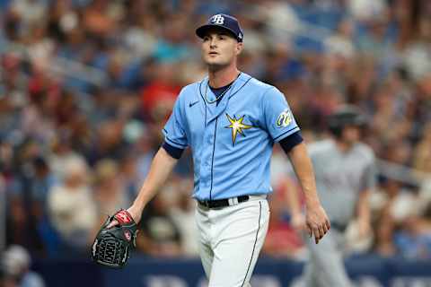 Jun 11, 2023; St. Petersburg, Florida, USA;  Tampa Bay Rays starting pitcher Shane McClanahan (18) walks off the field against the Texas Rangers in the third inning at Tropicana Field. Mandatory Credit: Nathan Ray Seebeck-Imagn Images