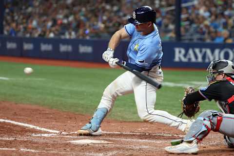 Jul 30, 2024; St. Petersburg, Florida, USA;  Tampa Bay Rays catcher Ben Rortvedt (30) hist a two-RBI single against the Miami Marlins during the sixth inning at Tropicana Field. Mandatory Credit: Kim Klement Neitzel-Imagn Images