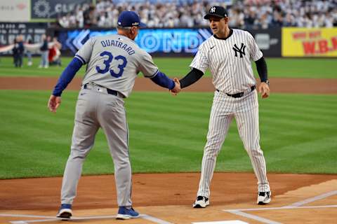 Oct 5, 2024; Bronx, New York, USA; Kansas City Royals manager Matt Quatraro (33) shakes hands with New York Yankees manager Aaron Boone (17) before game one of the ALDS during the 2024 MLB Playoffs at Yankee Stadium. Mandatory Credit: Brad Penner-Imagn Images