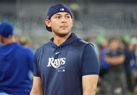 Jul 23, 2024; Toronto, Ontario, CAN; Tampa Bay Rays catcher Alex Jackson (28) walks towards the dugout during batting practice before a game against the Toronto Blue Jays at Rogers Centre. Mandatory Credit: Nick Turchiaro-Imagn Images