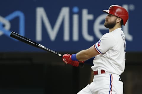 Jul 27, 2021; Arlington, Texas, USA; Texas Rangers right fielder Joey Gallo (13) hits a three run home run in the fourth inning against the Arizona Diamondbacks at Globe Life Field. Mandatory Credit: Tim Heitman-Imagn Images