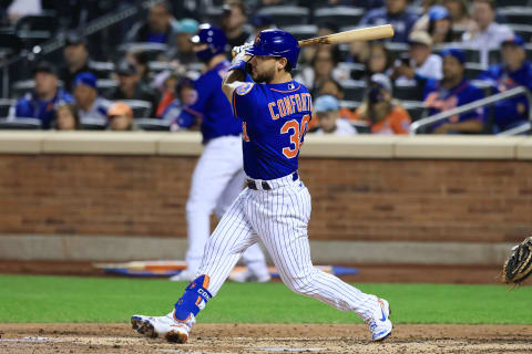 Sep 30, 2021; New York City, New York, USA; New York Mets right fielder Michael Conforto (30) hits