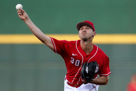 Cincinnati Reds pitcher Tyler Mahle (30) delivers during a spring training game against the Oakland