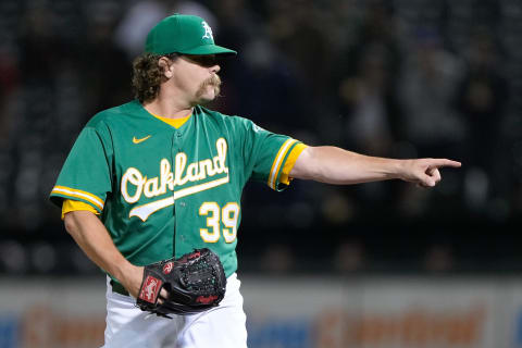 Sep 8, 2021; Oakland, California, USA;  Oakland Athletics relief pitcher Andrew Chafin (39) signals