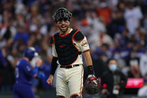 Former Reds catcher Curt Casali (2) smiles.