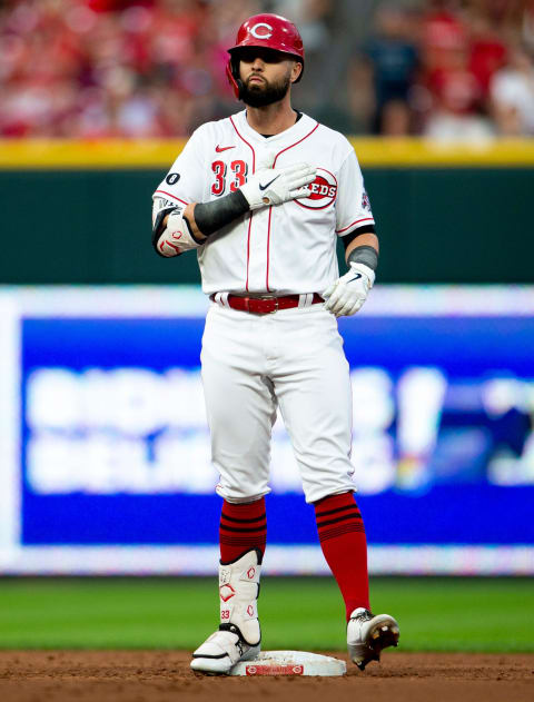 Cincinnati Reds right fielder Jesse Winker (33) puts his hand on his chest after hitting an RBI.