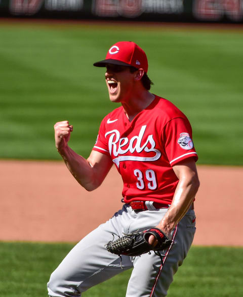 Cincinnati Reds relief pitcher Lucas Sims (39) celebrates.