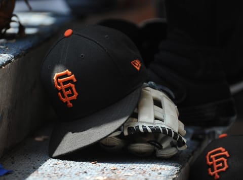 San Francisco Giants hat and glove in the dug out at Miller Park.