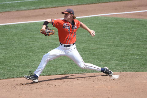 Virginia Cavaliers starting pitcher Andrew Abbott (16) pitches.