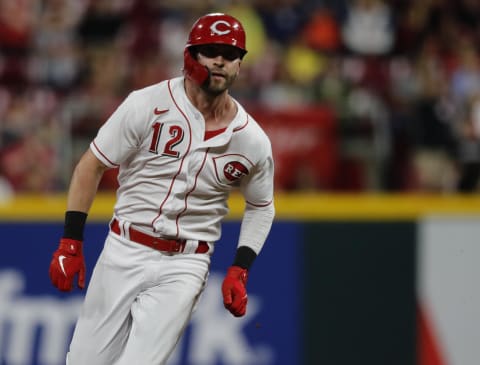 Cincinnati Reds pinch hitter Tyler Naquin (12) runs to third base.