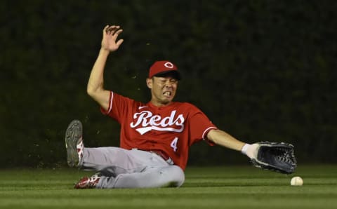 Cincinnati Reds center fielder Shogo Akiyama (4) tries to catch a fly ball.