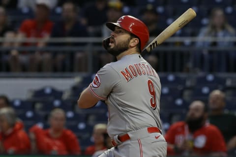 Cincinnati Reds third baseman Mike Moustakas (9) hits a double.