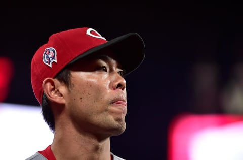 Cincinnati Reds left fielder Shogo Akiyama (4) looks on.