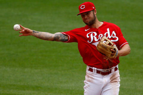 Cincinnati Reds second baseman Nick Senzel (15) plays a ground ball.