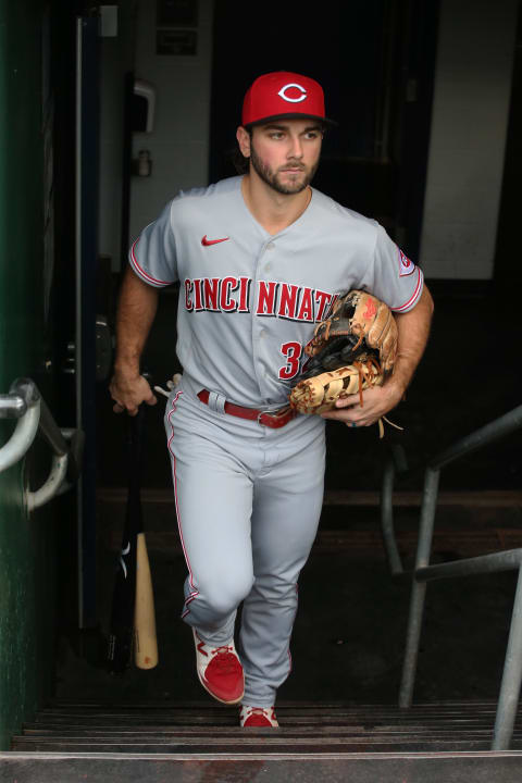 Cincinnati Reds left fielder Max Schrock (32) enters the field.