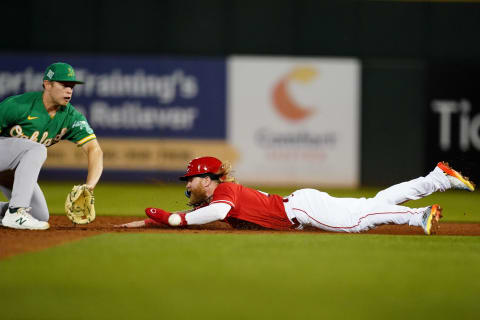Cincinnati Reds outfielder Jake Fraley (27) steals second base during a spring training game.