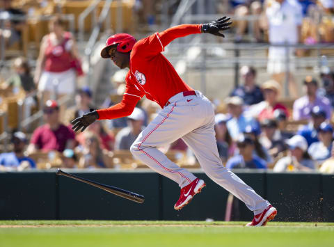 Cincinnati Reds outfielder Aristides Aquino runs down the first-base line.