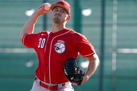 Cincinnati Reds pitcher Tyler Mahle (30) delivers during live batting practice.