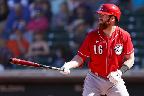 Cincinnati Reds infielder Colin Moran (16) gets set for a pitch during a spring training game.