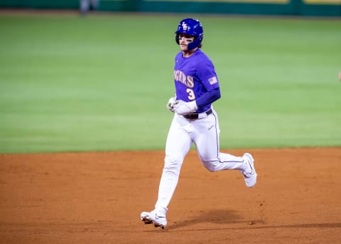 Dylan Crews rounds the bases after a homerun as The LSU Tigers take on the Butler Bulldogs.