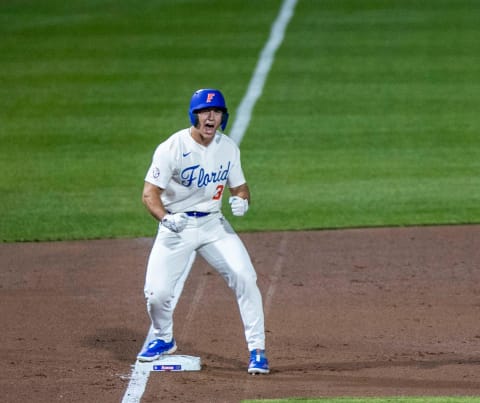 Florida's outfielder Wyatt Langford (36) with a triple in the bottom of the first inning.