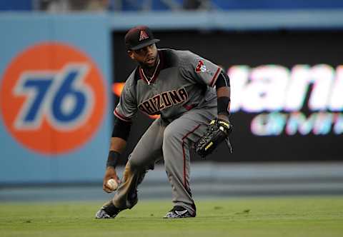 July 30, 2016; Los Angeles, CA, USA; Arizona Diamondbacks left fielder Rickie Weeks (5) fields a hit