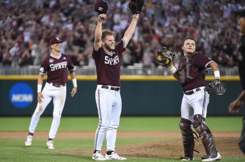 Jun 30, 2021; Omaha, Nebraska, USA;  Mississippi St. Bulldogs pitcher Landon Sims (23) and catcher