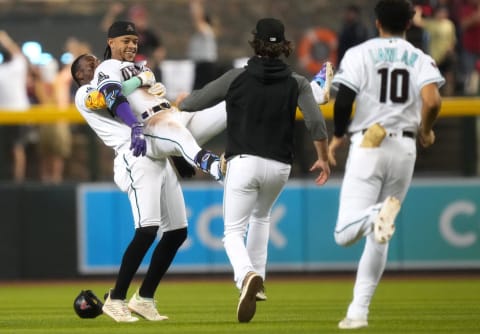 Arizona Diamondbacks Ketel Marte (4) is embraced by teammate Geraldo Perdomo (2) after his walk-off