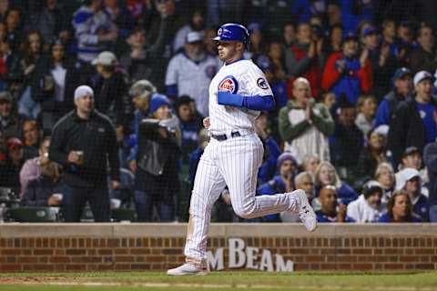 Sep 27, 2022; Chicago, Illinois, USA; Chicago Cubs left fielder Ian Happ (8) scores against the