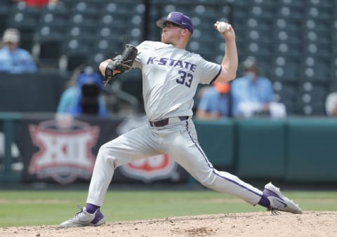 May 26, 2021; Oklahoma City, Oklahoma, USA; Kansas State pitcher Jordan Wicks (33) delivers a pitch