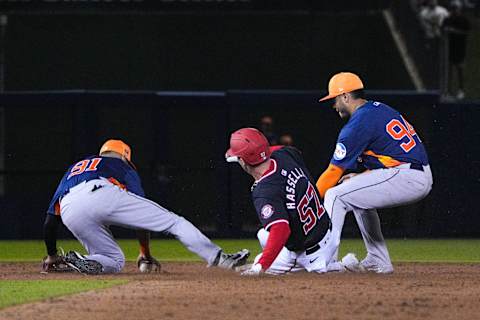 Nationals' Robert Hassell, 57, slides safely to second base during a training game between the Houston Astros and Washington Nationals on Saturday, February 24, 2024 at the Cacti Stadium in West Palm Beach.