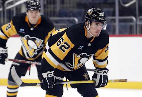 Sep 24, 2023; Pittsburgh, Pennsylvania, USA; Pittsburgh Penguins center Brayden Yager (62) prepares to take a face-off against the Columbus Blue Jackets during the third period at PPG Paints Arena. Pittsburgh won 3-2 in a shootout. Mandatory Credit: Charles LeClaire-USA TODAY Sports