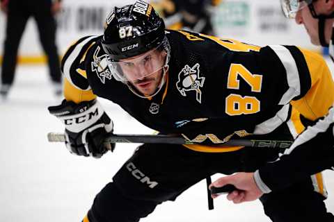 Apr 11, 2024; Pittsburgh, Pennsylvania, USA;  Pittsburgh Penguins center Sidney Crosby (87) prepares to take a face-off against the Detroit Red Wings during the first period at PPG Paints Arena. Mandatory Credit: Charles LeClaire-USA TODAY Sports