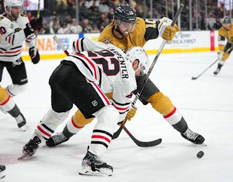 Jan 8, 2022; Las Vegas, Nevada, USA; Chicago Blackhawks center Ryan Carpenter (22) ties up the stick