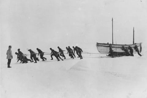 Members of Shackleton's Trans-Antarctic Expedition pull one of their lifeboats across the snow following the loss of the 'Endurance.'