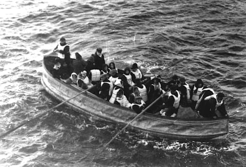 'Titanic' survivors approach the RMS 'Carpathia' in one of the collapsible boats.