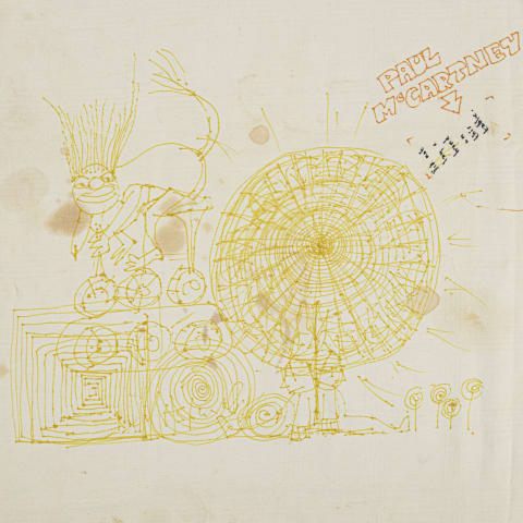 John Lennon's tablecloth doodle next to Paul McCartney's name.