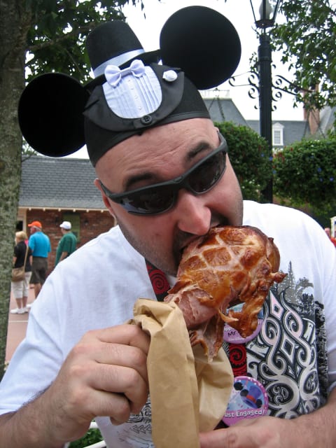 A Disney guest toasts his recent engagement with a turkey leg in EPCOT in 2012.