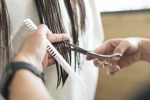 Trimming hair.