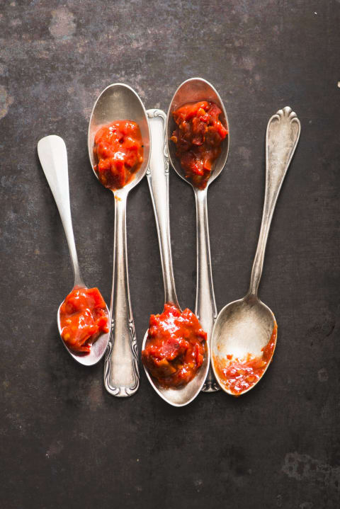 Sambal sauce on spoons.