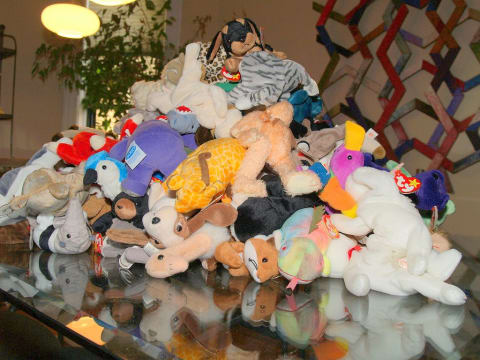 Beanie Babies collection piled on a table.