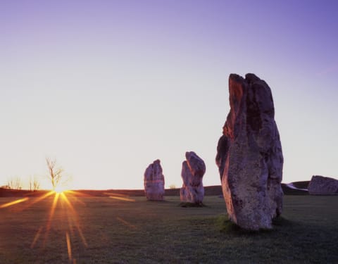 Sunrise on the vernal equinox at the Avebury Standing Stones in England.