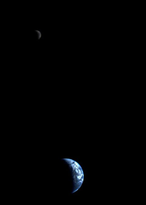 Voyager 1's photo of a crescent-shaped Earth and moon was made Sept. 18, 1977, from about 7.25 million miles away.