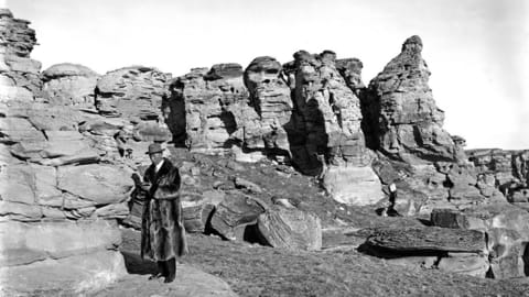 Barnum Brown doing field work in Montana in his fur coat,  circa 1914.