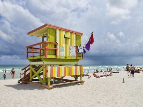 A purple flag below a red flag in Miami's South Beach.