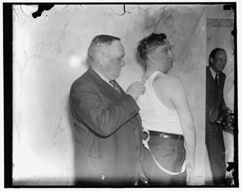 A UMWA union rep displays a bullet wound during a 1937 Senate investigation into the Harlan County deputy sheriffs' conduct.