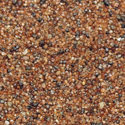 Heavy mineral sand composed mainly of garnet crystals at Cape Nome, Alaska.