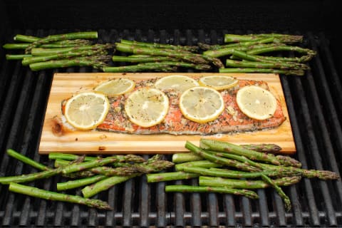 The planks cook fish like salmon via indirect heat, helping keep the meat moist and intact.