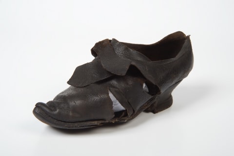 This women’s leather buckle latchet shoe, dating from the 1770s, was found in thatched roof of a cottage in Lincolnshire, UK.